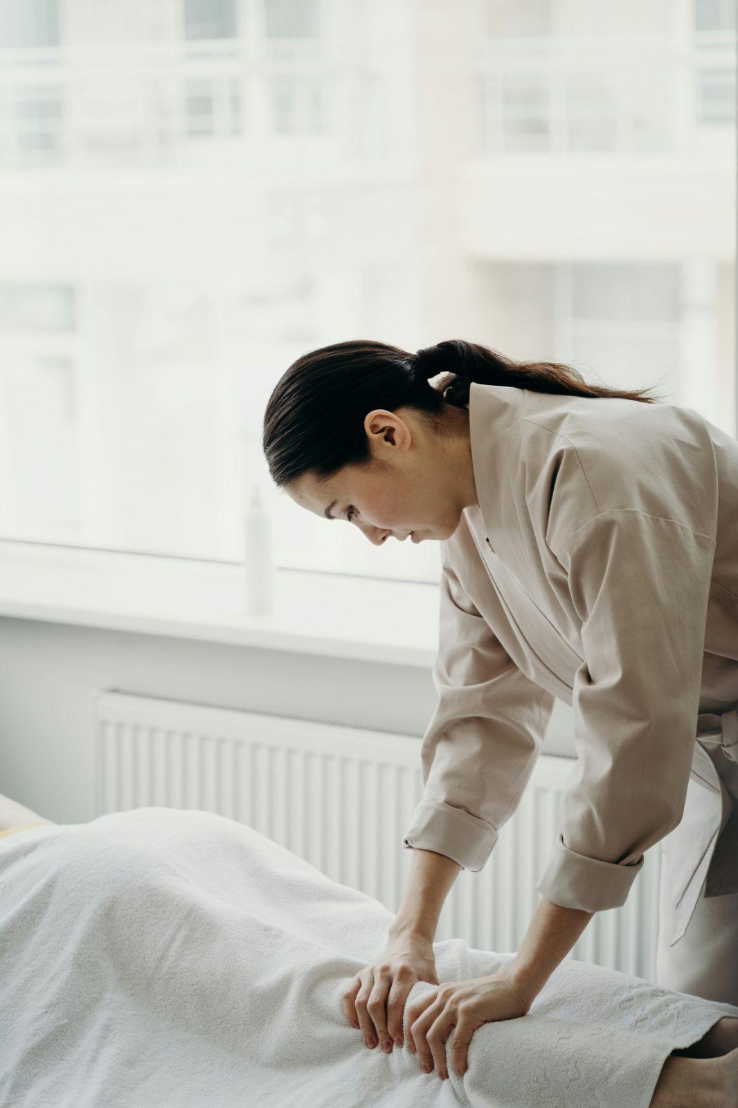 An esthetician preparing a spa treatment